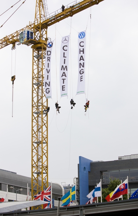 Greenpeace activists are demonstrating in front of the European Council during the Environment Council meeting