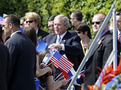 American President George W. Bush is greeting the children