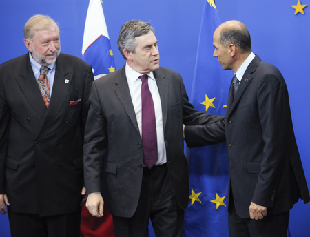 British Prime Minister Gordon Brown (C) welcomed by the Slovenian Minister of Foreign Affairs Dimitrij Rupel (L) and President of the European Council, Slovenian Prime Minister Janez Janša (R)