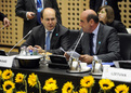 Greek ministers Konstantinos Hatzidakis and Georgios Voulgarakis before the session