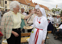 European Commissioner Mariann Fischer Boel admires one of the Slovenian traditional costumes